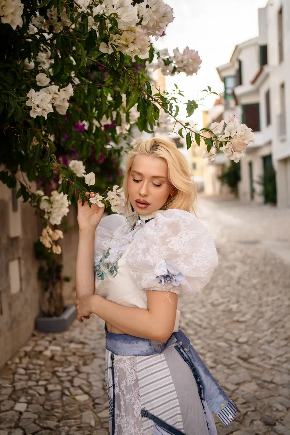 Navy corded lace off-shoulder blouse with white lace flares